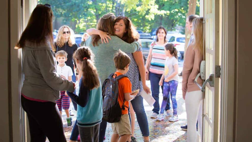 welcoming congregants welcoming each other at boston suburb temple 